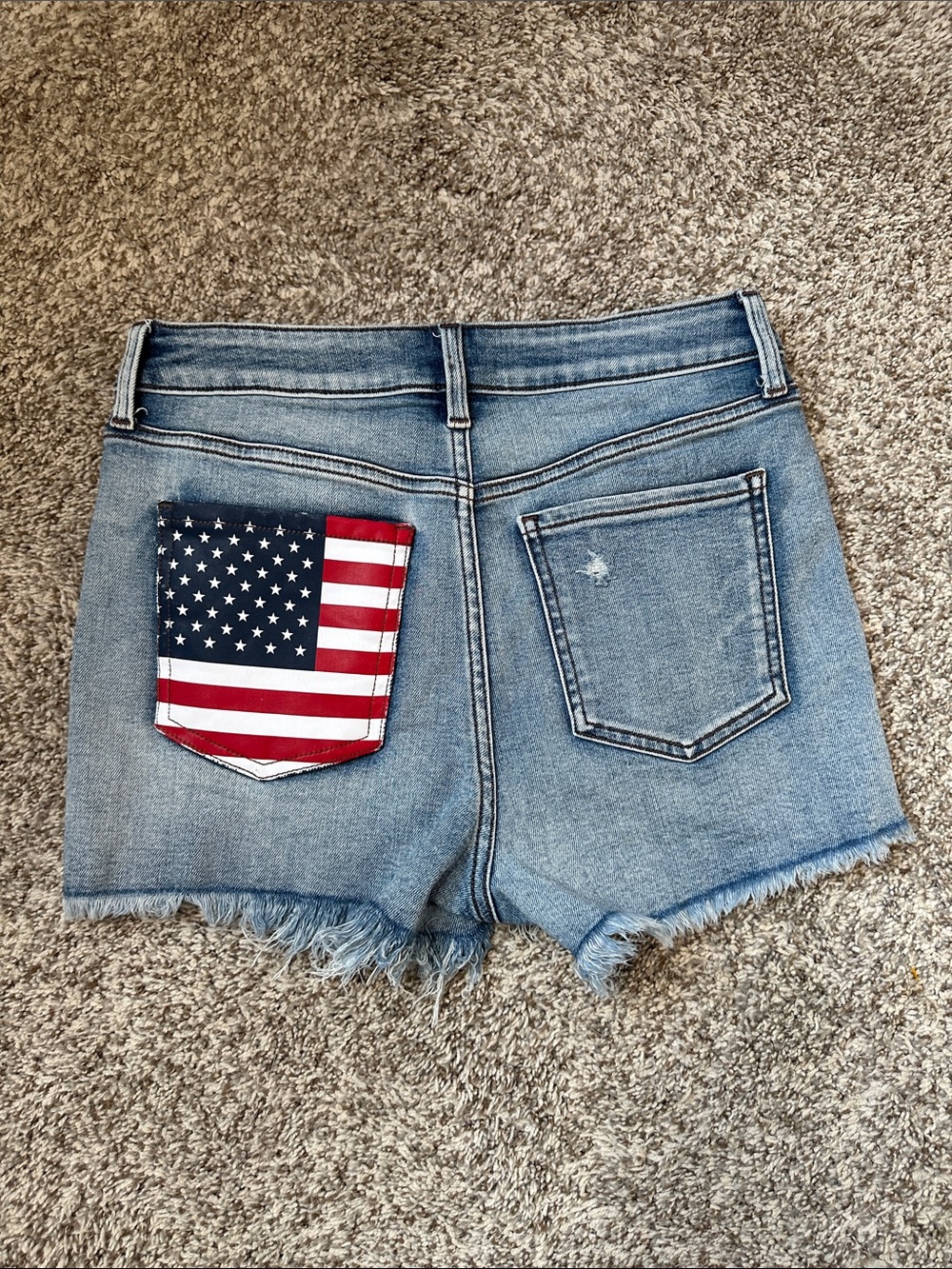 Francesca's Collections Harper Light Wash Denim Shorts with American Flag Pocket